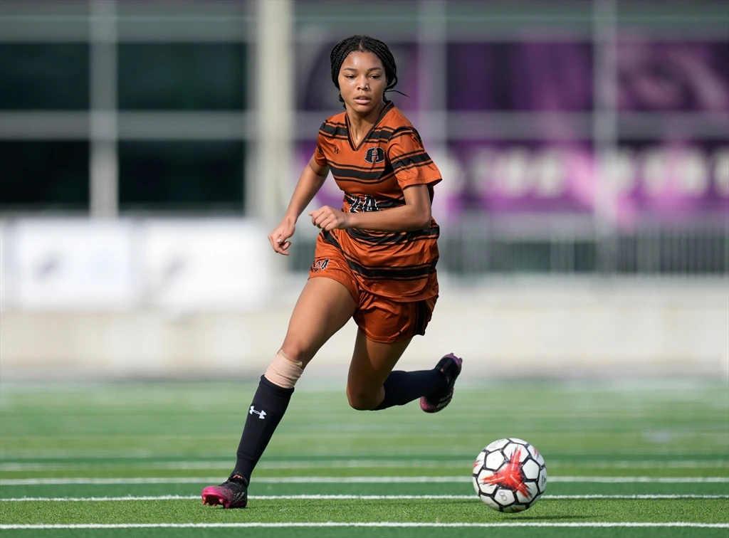 Soccer player controlling the ball during a match